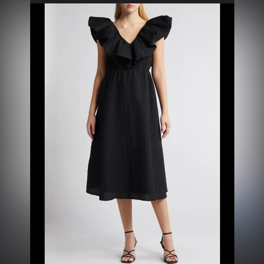 Black crepe ruffle collar dress with pockets.  Never worn !
